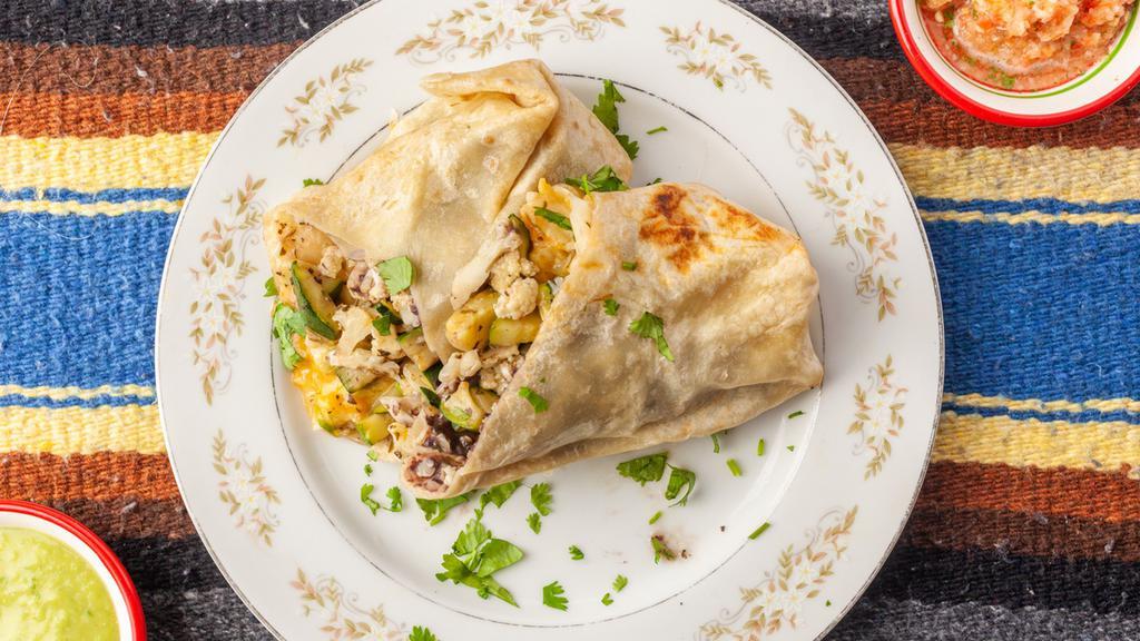 Vegetal (Vegetarian) Combo · Grilled, herb infused seasonal vegetables wrapped in a warm flour tortilla with Oaxaca style yellow rice, avocado bean puree, Mexican cheese, and crispy lettuce.  Includes handmade yellow corn chips and two salsas.
