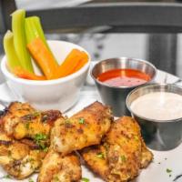Oven Roasted Jumbo Wings · Wood fired roasted Jumbo Wings served with carrots, celery, a side of buffalo sauce and Blue...