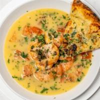 Scampi Appetizer · Jumbo shrimp tossed in lemon garlic and white wine sauce, served with garlic bread.