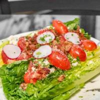Romaine On The Edge · Romaine lettuce, bacon, tomatoes, radish, blue cheese crumbs with Parmesan cream dressing.