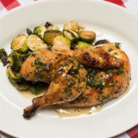 Oven Roasted Heritage Half Chicken · With roasted vegetables and pan sauce.