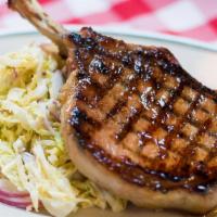 Grilled Bone-In Pork Chop · With mustardy cabbage cole slaw.