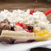 Banana Split · Three scoops of any ice cream flavor. Drizzled with pineapple, and strawberry sauce, and top...