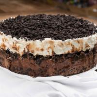 Signature Ice Cream Cake · House made vanilla and chocolate ice cream with a cookie and  fudge base, center and topping...