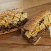 Fat Boi Cheesesteak Sandwich · Halal ribeye, caramelized onions, cooper sharp cheese, on a toasted artisan Italian seeded r...