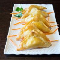 Crab Rangoon (6 Pieces) · Crab and cream cheese filled wontons fried till golden brown.