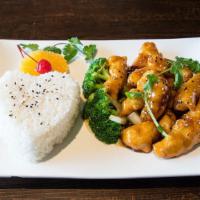 Thai Sesame Chicken · Crispy chicken nuggets tossed in a sweet and spicy sesame sauce served on a bed of steamed v...