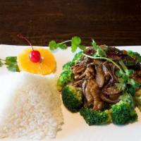 Mongolian Beef · Stir-fried beef with green onion, red onion in spicy sweet soy sauce served on a bed of stea...