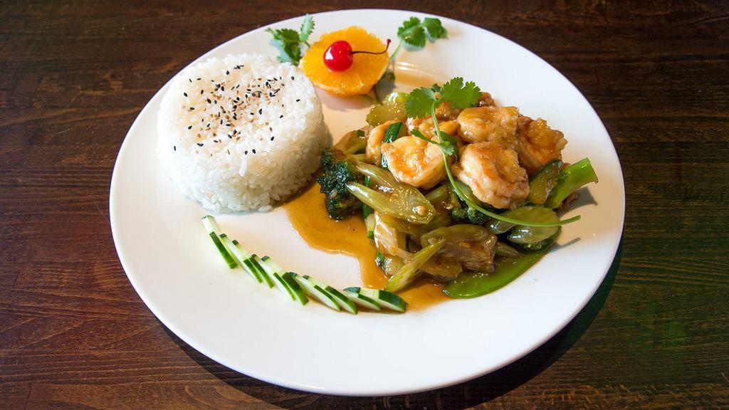 Spicy Garlic Shrimp · Wok tossed shrimp and vegetables with garlic and sambal oelek chili. Served with fried, brown or white rice and crispy spring roll.