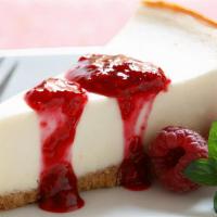 Cheesecake Sundae · Served with vanilla ice cream, strawberry, peanuts and chocolate topping.