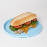 Tuna Melt Sandwich · Tuna salad, melted cheddar, tomato, lettuce, and onion on an Italian roll.
