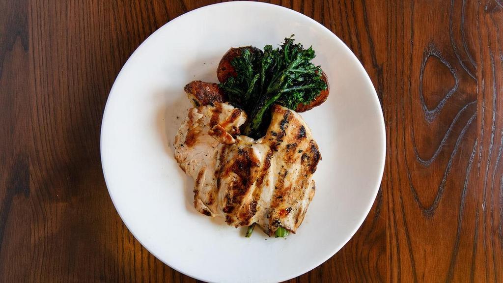 Grilled Marinated Chicken  · grilled broccolini, roasted red bliss potatoes, lemon roasted garlic butter