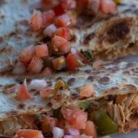 Grilled Chicken Quesadilla · Crispy flour tortilla stuffed with cheddar-jack cheese, grilled chicken, peppers, onions and...