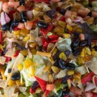 Chipotle Chopped Salad · Romaine tossed in chipotle ranch with roasted corn, pico de gallo, shredded cheese, avocado,...