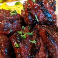 Steak Tips · Fresh choice char-grilled steak tips, glazed with Café sauce. Served with choice of two sides.
