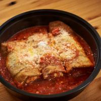 Rollatini · garden fresh eggplant stuffed with three  cheeses & topped with a plum tomato sauce