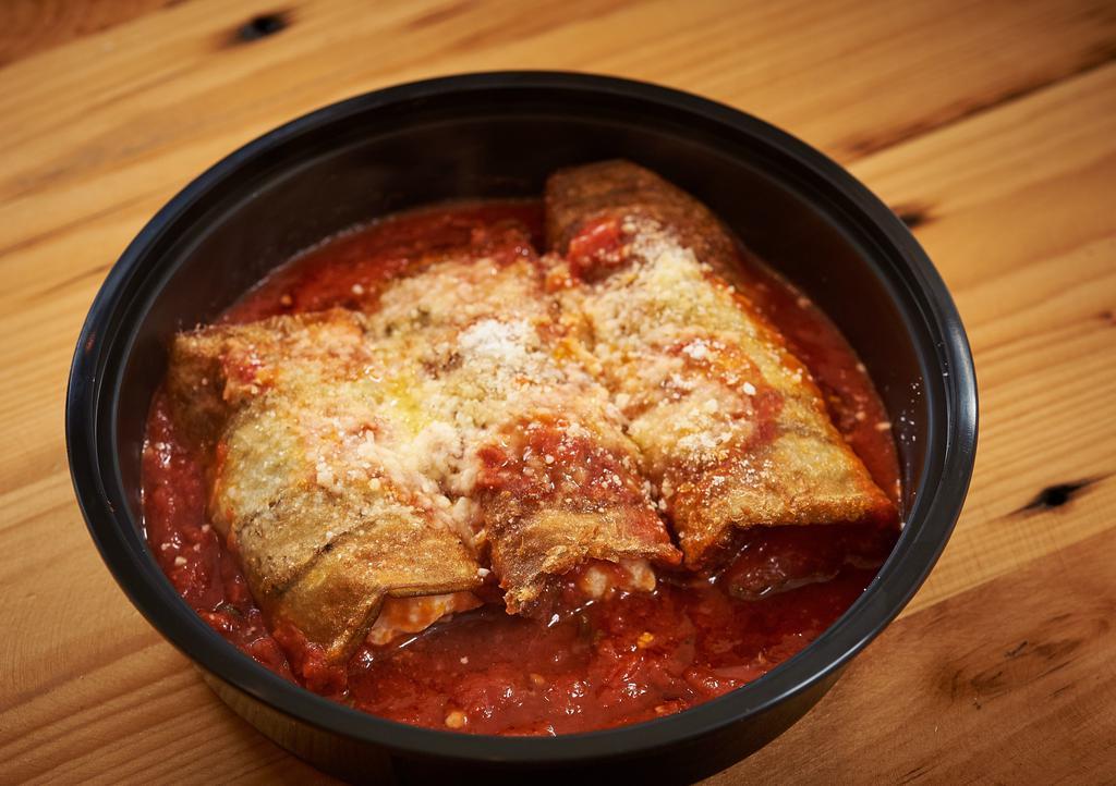 Rollatini · garden fresh eggplant stuffed with three  cheeses & topped with a plum tomato sauce