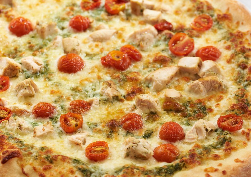Chicken Pesto Pizza · grilled chicken, basil pesto, oven dried  tomato & mozzarella cheese