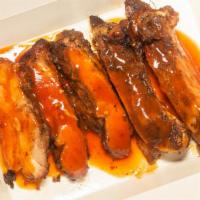Bbq Turkey Ribs · Turkey thighs wood grilled until tender and juicy then cut into rib size pieces and topped w...