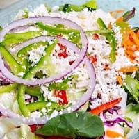 Greek Salad · Crispy iceberg lettuce topped with imported greek feta, plum kalamata olives, sun-ripened to...