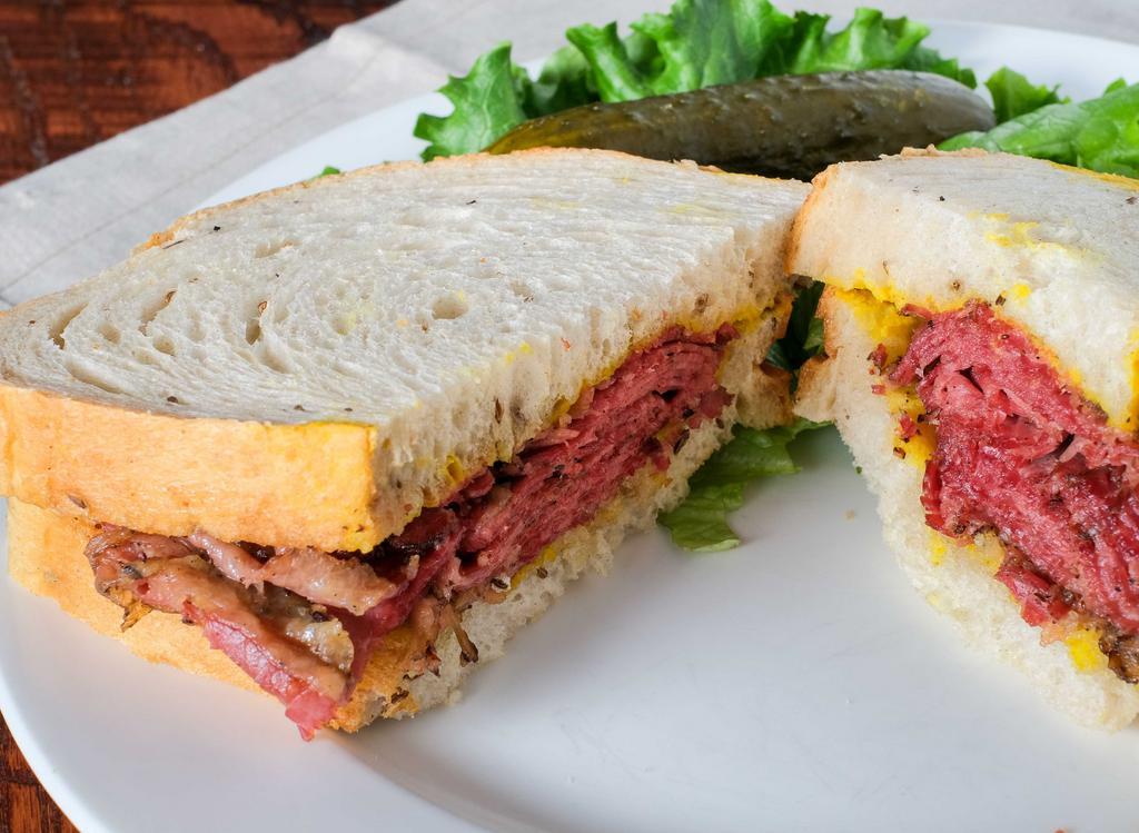 Famous Smoked Brisket Sandwich · Our famous smoked brisket & light yellow mustard on rye.