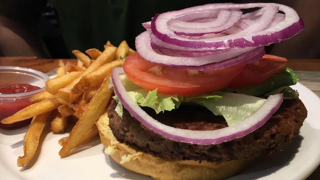 The Impossible Burger · 100% vegan. No animal products, made with plant proteins. If you love meat, you will love this burger! Shredded lettuce, tomato, pickle, red onions, american cheese and our special burger sauce. Served on our Hawaiian sesame seed bun.
