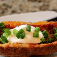Loaded Potato Skins · Crispy Maine-Grown white potatoes topped with a layer of melted cheddar and crispy bacon ser...