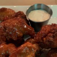 Chicken Wings - 6 Piece · Crispy, juicy and deliciously messy. They literally fly out the door. Extra sauce for an add...