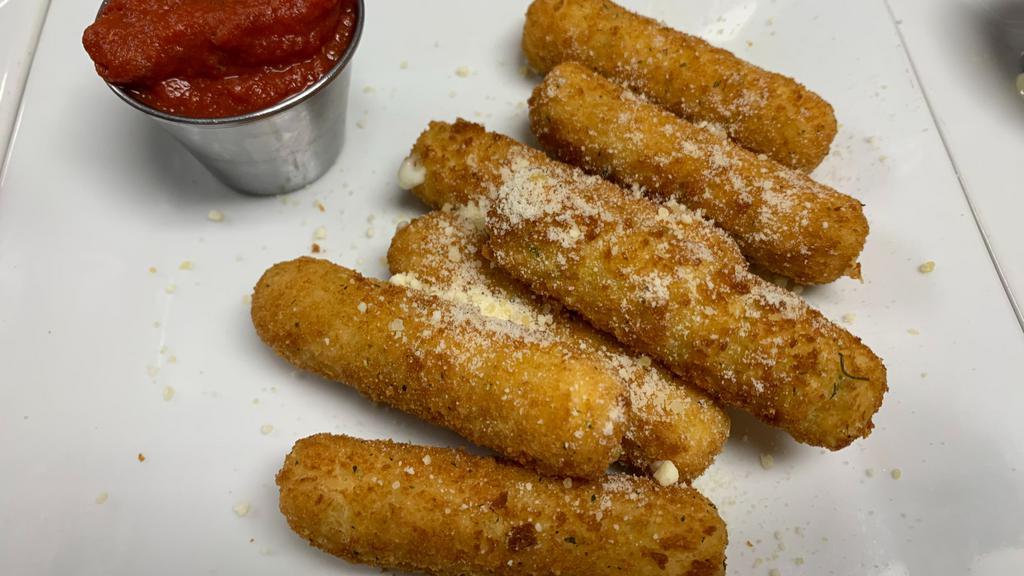 Mozzarella Sticks · Who can resist the stringy cheesy goodness of the golden fried mozzarella cheese sticks. Served with our delicious homemade sauce. (7 pieces per serving).