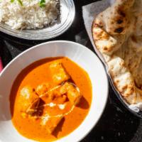 Chicken Tikka Masala (Halal) · Cubes of chicken tikka simmered in a rich tomato cream sauce. Served with fragrant Basmati r...