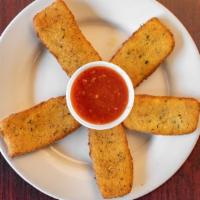 Homemade Mozzarella Sticks · Mozzarella cheese that has been coated and fried.