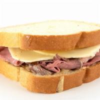 Roast Beef On Sourdough · Thinly sliced roast beef, provolone, and creamy whole grain mustard on sourdough bread.