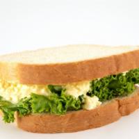 Egg Salad On Sourdough · Egg salad and lettuce on sourdough bread.