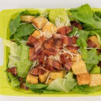 Caesar Salad · Fresh Romaine lettuce topped with chopped bacon, parmesan, crunchy croutons, and creamy Caes...