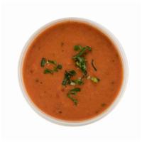 Tomato Bisque · Rich, creamy bisque full of fresh tomatoes and a touch of basil.