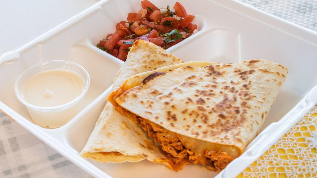 Quesadilla · Cooked tortilla that is filled with cheese and folded in 1/2. choose a meat.