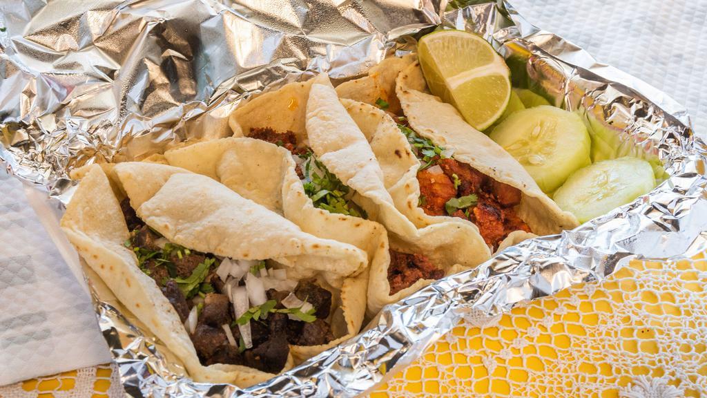 Tacos · Folded tortilla with a variety of fillings such as meat or beans. choose a meat.