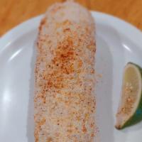 Elotes · Corn on cob with mayo, cheese and chill powder.
