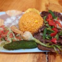 Carne Asada · Bistec, arroz, frijoles, ensalada, and tortillas. / Grilled steak, rice, beans, salad, and t...