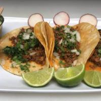 Tacos · Three tacos in one order. Cebolla and cilantro/ Onion y cilantro. 
Bistec, Al pastor, pollo,...