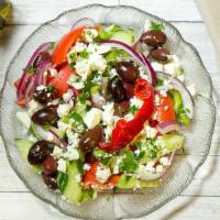 Horiatiki (Village Salad) · Tomatoes, cucumbers, onions, green peppers, feta cheese and olives, topped with olive oil an...