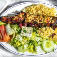Chicken Kebab · Delicious marinated chicken breast on a skewer with green pepper and onions, cooked on charc...