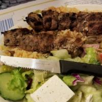 Lamb Shish Kebab · Delicious mannated lamb on a skewer with green peppers and onions, cooked on charcoal.