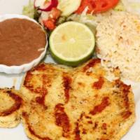 Grilled Chicken Platter/Pechuga Asada · Grilled chicken, served with rice, beans, side salad and 2 thick handmade corn tortillas.