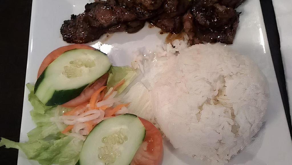 Grilled Beef With Jasmine Rice · Char-grilled marinated beef on jasmine rice.