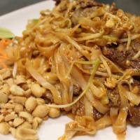 Pad Thai · Rice noodles, egg, bean sprouts and scallions pan-fried in our sweet tamarind sauce garnishe...
