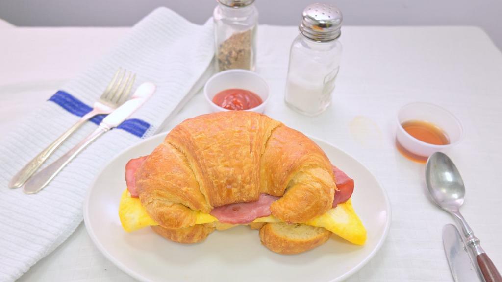 2 Eggs With Cheese & Meat Sandwich · Served on your choice of White, English Muffin, Croissant or Brioche Bun