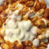 Gnocchi Classico
 · Homemade potato pasta. Baked with fresh tomato sauce, a touch of locatelli cheese and melted...