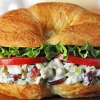 Chicken Salad · 540 calories. Freshly made Chicken Salad with lettuce and tomato on a flaky croissant.