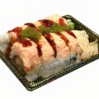 Ocean Roll · Shrimp tempura, avocado top with lobster salad, wasabi tobiko and shrimp sauce.